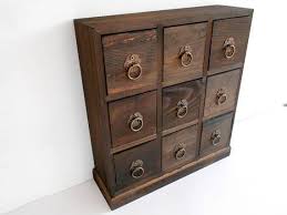 You can still buy this cabinet online for about $300. Wooden Drawers Box 9 Drawers Jewelry Chest Of Drawers Apothecary Cabinet Desktop Organizer Trinket Storage C Wooden Drawers Drawer Box Organize Trinkets
