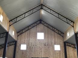 Galvanized Steel Ceiling Against The Exposed Beams And Shiplap Are A Wonderful Contrast Metal Building Homes Metal Beam Steel Beams