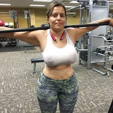 Milf showing her big boobs and nipples through her transparent tank tops  inside a gym