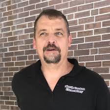 Behind the mops and brooms, it's all about the kids