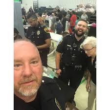 Mayor Lynn Clark, Officer Koshy, Officer Theriault and Officer Lane staring  in the stages of a group selfie! Enjoy! 😏🤪 #SillySelfie #GroupSelfie  #CopLife #HCPD