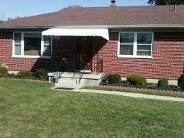 Southern white porch with swings. This 50 S Ranch Needs A Revamped Front Porch Help
