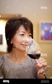 Woman drinking glass wine hi-res stock photography and images