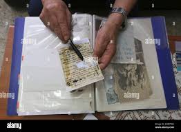 In this Aug. 22, 2018, photo, Shim Goo-seob, 83, reads a letter sent from  his younger brother in North Korea, during an interview at his office in  Seoul, South Korea. Only a