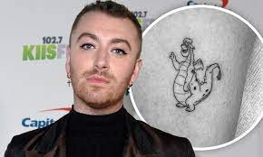 Sam released his debut album, in the lonely hour in 2014 many of whose songs reached the uk top ten and also won him four grammy awards. Sam Smith Showcases Their New Black And White Tattoo Of Elliott From The Disney Film Pete S Dragon Daily Mail Online