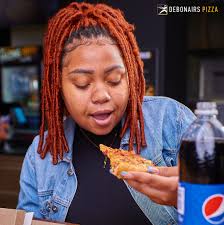 Looking at that pizza slice, then it hits you — OH!! It's 18th October! 😎  Nomba feeling ya Amazing, ungachite bwanji bululu! 😃 #TrySomethingAmazing
