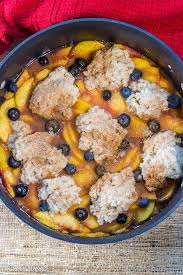 Once all powder is moist, put pats of butter evenly over the top of the mixture. Dutch Oven Peach Cobbler With Fresh Peaches Flavor Mosaic