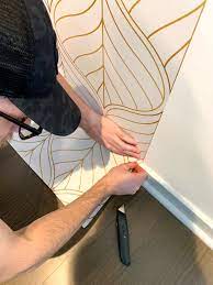 Once your wallpaper is all in place, you can replace any outlet or light covers and put your furniture and pictures back in place. Diy Accent Wall How To Apply Temporary Wallpaper In A Rental Apartment Katie S Bliss