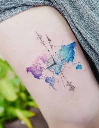 Men's upper arm piece with a compass on top of a map, done in black and grey. Compass Tattoos Main Themes Tattoo Styles Ideas