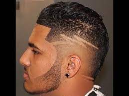 The low fade provides less contrast and a consider a high fade comb over with a hard part and cool design for an awesome, outgoing look. How To Fade Burst Fade With Design By Zay The Barber Odell Beckham Haircut Youtube