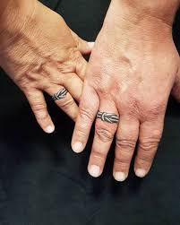 I think that the most popular one is making a tattoo with your wedding date with usual or roman numbers, and many celebrities have already rocked this thing. Couple Ring Tattoo Designs For Ring Finger Tattoos Ring Finger Designs Wedding Band Tattoos For Women Heart On Ring Finger Tattoo Couple Tattoo Design Finger Cute Ring Tattoos Couple Ring Tattoo Design