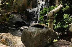 Beautiful decorative japanese home garden bamboo waterfall pond. Water Features Green Giant Landscape Design
