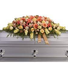 With you here the world was a better place. Warmest Remembrance Casket Spray Casket Flowers
