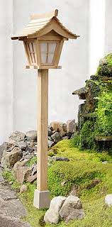 Japanese Garden Lantern In Daylight Japanese Garden Lanterns Garden Lanterns Wooden Lanterns