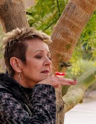 My better half, Marleina-Chickie (Hahn) Hampton (67) enjoying the  morning... the Harley days are few and far between...