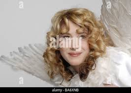 Donna camuffare il Natale-angeli ritratto sorride persone serie 30-40 anni  riccioli biondi angel-outfit angel-ali allegramente Foto stock