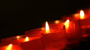 Row Of Christian Prayer Red Round Votive Candles Burn In The Dark Prayer Lighting Sacrificial Candles Close Up Burning Memorial Candles In Catholic Church Celebrating Christmas In Cathedral Stock Video C