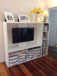 Its tall size ensures a wonderful elevation to. Ikea Lapland Tv Unit With Books And Storage Baskets Tv Storage Unit Tv Storage Tv Unit Design