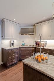 The term two tone or multi colored kitchen cabinets refers to any kitchen that combines two different color cabinetry. Shaker Kitchen Two Toned Cabinets Two Tone Kitchen Cabinets Kitchen Renovation Painting Kitchen Cabinets