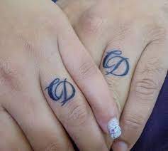 55 Wedding Band Tattoo Ideas To Rock Wedding Ring Finger Tattoos Ring Tattoo Designs Ring Finger Tattoos