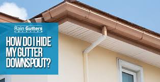 Once the project had been completed, you wouldn't know there were any gutters and downspouts on this roof. How Do I Hide My Gutter Downspout