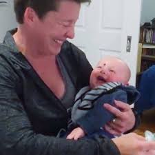 Baby Laughs at Mom Putting Pacifier in Mouth