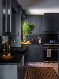This charming kitchen blends natural wood, open shelves, and black cabinets for a look that's both modern and timeless. 6 Kitchens That Make Terracotta Floors Feel Fresh Dark Grey Kitchen Cabinets Grey Kitchen Designs Grey Kitchen Cabinets