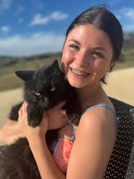 Lost black and white furry dog in Harrisburg, IL