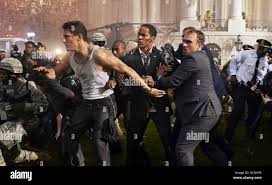 WHITE HOUSE DOWN, Channing Tatum (wife-beater), Jamie Foxx (loose tie),  2013. ph: Reiner Bajo/©Columbia Pictures/Courtesy Stock Photo