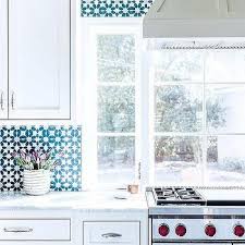 Not all that long ago, the stove was part of a big chimney structure. Stove Under Window Design Ideas