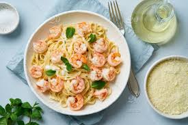 Stir in both types of salsa, chilies and lime juice; Pasta Shrimp Bechamel Bavette Top View Above Sauce Mint Leaf Blue Light Seafood Italian Food Dill Table Gray Plate White Spaghetti Shrimps Delicious Cuisine Creamy Background Healthy Meal Mediterranean Gourmet Dinner Cheese