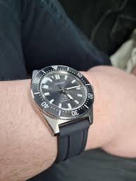 The sunburst is very subtle, displaying a subdued fanning in low light and coming to life in bright light with a nicely distributed burst that isn't too flashy or focused. Spb143j1 On A Black Strap Seiko