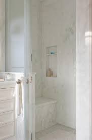 The room's crisp white palette carries. Gorgeous Wing Out Frosted Glass Door Opens To A Walk In Shower Fitted With A White Marble Slab Show Green Marble Bathroom Bathroom Shower Doors Marble Showers