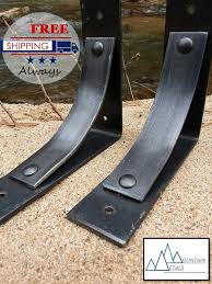 A floating shelf may have two or more channels open from the back towards, but without reaching, the front, into which slide fasteners attached to the wall. One Shelf Bracket Metal Shelf Brackets Iron Shelf Brackets Etsy Metal Shelf Brackets Metal Shelves Iron Shelf Brackets