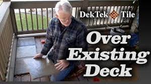 Use the tack cloth to remove any debris caused by the sanding of the primer. How To Install Dektek Tile S Concrete Deck Tiles Over Existing Wood Decking Youtube
