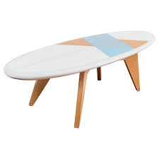 The bottom tier slides out to a boomerang design, or can be used. Surfboard Coffee Table For Sale At 1stdibs