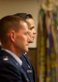 U.S. Air Force Maj. Hamilton Underwood, right, and