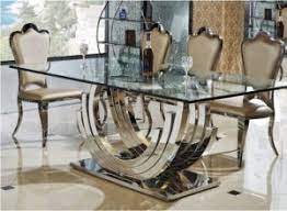 Dining table w/8 chairs features a turned double pedestal base with ball & claw style legs, patterned veneer table top with fluted edges, and 8 matching chairs. China Royal Stainless Steel Glass Dining Table Set For Sale Sdt 016 China Dining Chair Sideboard