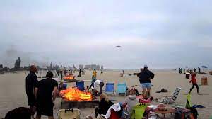 Dumped in sand and gravel within open pits previously dug by bulldozer; Coronado Beach Bonfire With Navy Jet Landing Youtube