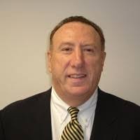 Coach Peter Michell is being honored by his alma mater; he was high school  All-American in basketball, played at Georgetown and professionally  including a season with the New Orleans Buccaneers.