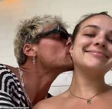 Abbie Chatfield hoses herself down while cavorting around in a skimpy green  bikini