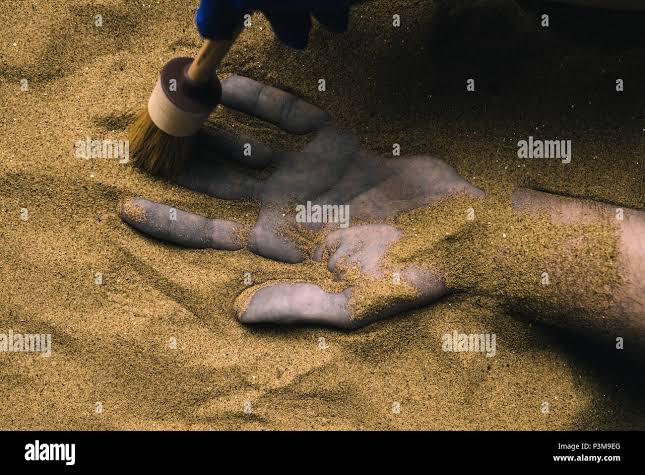 Forensic expert discovering dead body buried in desert sand. Conceptual  image for police investigation of an cold case murder crime scene Stock  Photo - Alamy
