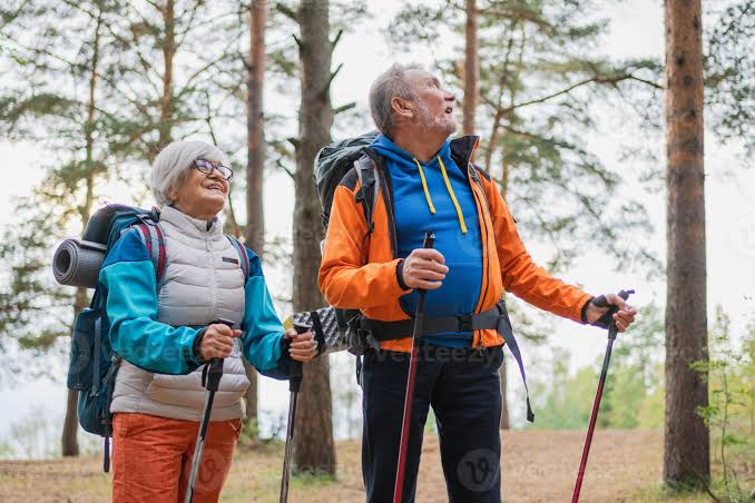 Hiking tourism adventure. Senior couple man woman enjoying outdoor ...