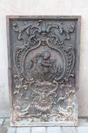 A fireback protects the back wall of the fireplace against splitting and crumbling. Cast Iron Fireplace Back Plate The Cherub Fireplaces Search Results European Antiques Decorative