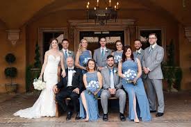 Bridesmaids Wearing Long Steel Blue Dresses Groomsmen Wearing Grey Suits With Hints Of Stee Steel Blue Bridesmaid Dresses Steel Blue Dress Blue Themed Wedding