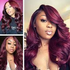 Directly in the middle of blue and red hair, there's a shade rarely explored by even the most adventurous hair guru: Deep Burgundy Hair On Dark Skin