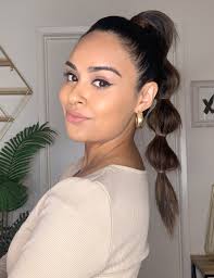 Next, take a small section of hair from the underside of your ponytail and wrap it around your hairband to hide it. 20 Easy Ponytail Hairstyles To Try At Home Ipsy