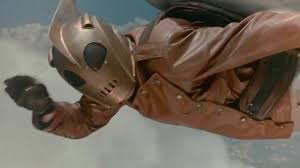 Armed with her cool new gear and secret identity, she takes to the skies to protect her town. The Rocketeer An Adventure Movie Out Of Time Den Of Geek