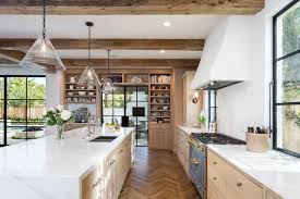 A stainless steel range and oven is flanked by classic white cabinets with nickel hardware. Transitional Style Kitchens Everything You Need To Know