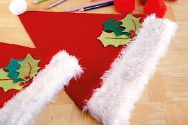 Easy DIY Christmas decoration ideas including how to make Christmas Santa hats and homemade paper decorations